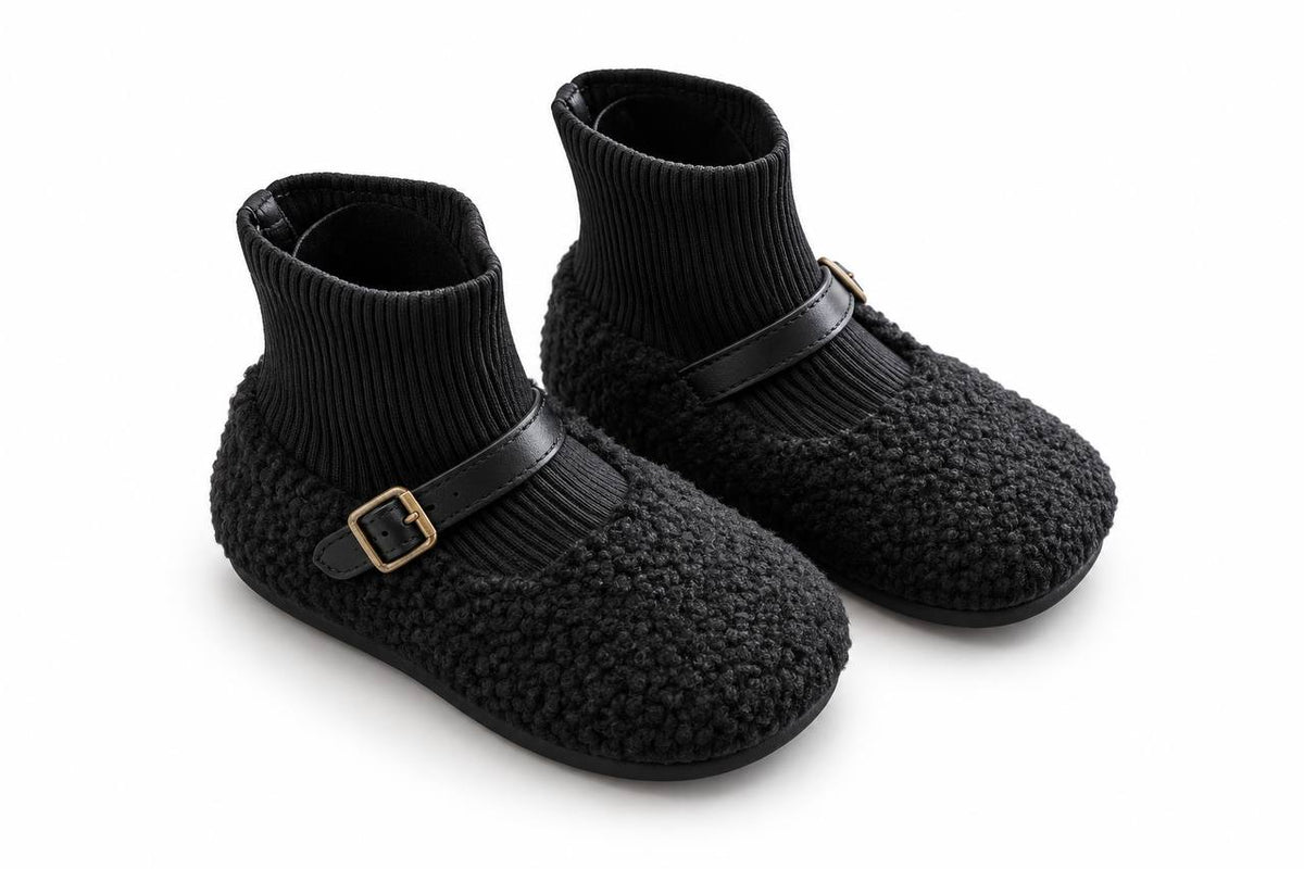 Black bouclé ankle boots with ribbed knit shaft and buckle strap